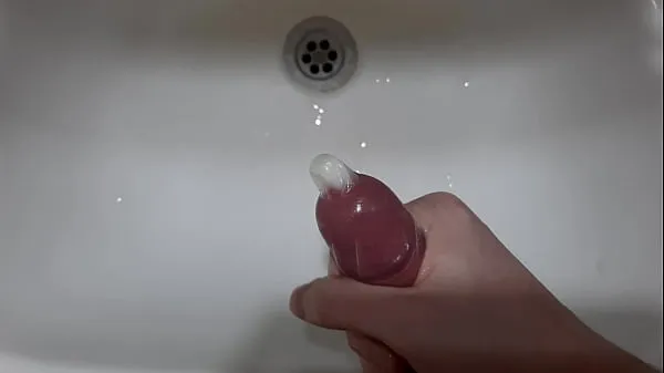 Watch Masturbating 6 inch cock & finish in a Condom energy Clips